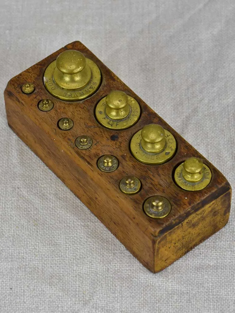 Set of eleven antique French weights for scales - 1-200g