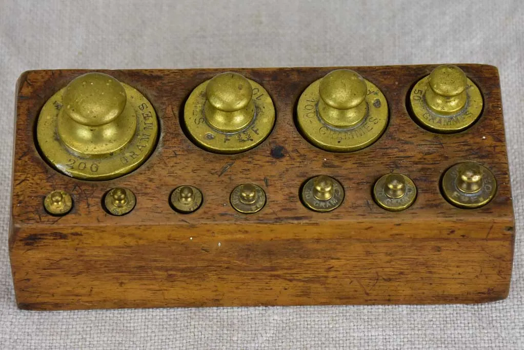 Set of eleven antique French weights for scales - 1-200g